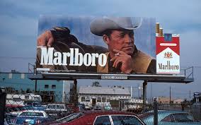 Second Marlboro billboard with Roy's likeness above a city street.